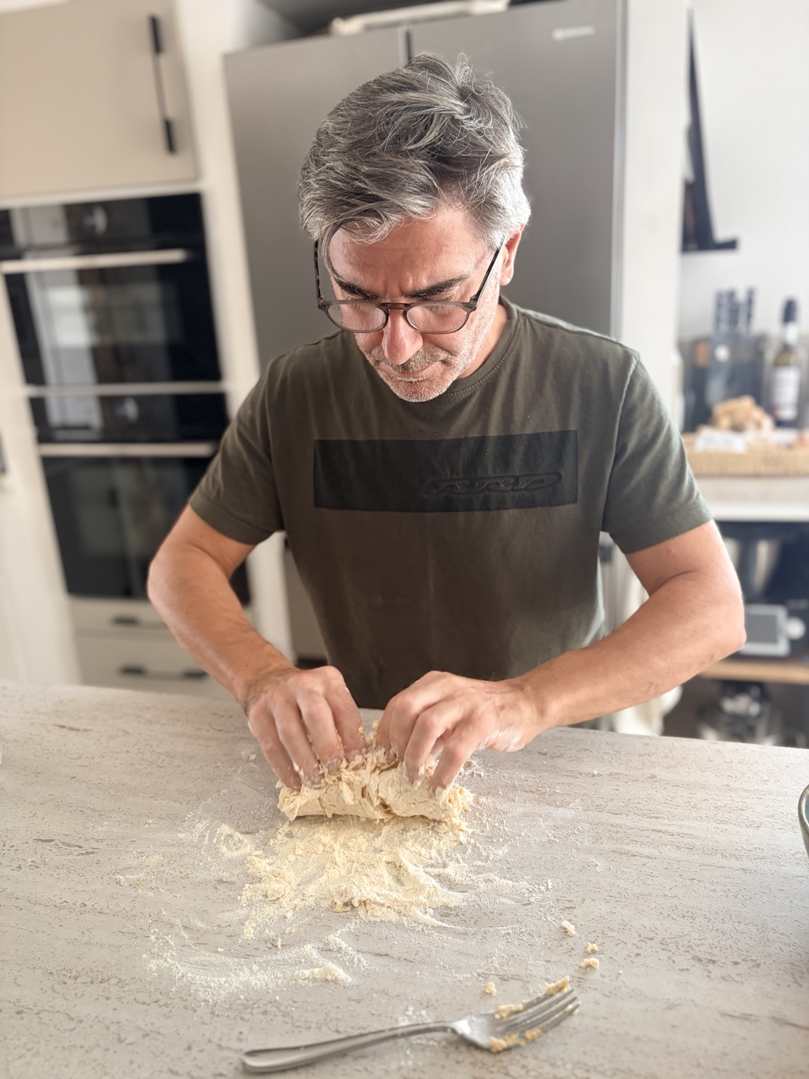Sal bringing fresh pasta dough together by hand